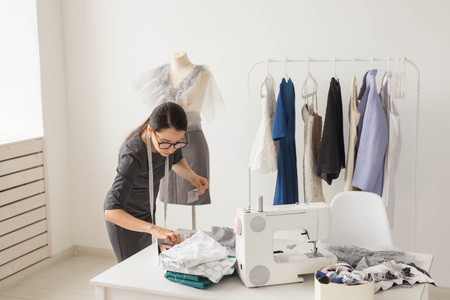 Dressmaker, tailor, fashion and showroom concept - Portrait of talented female dressmaker working...