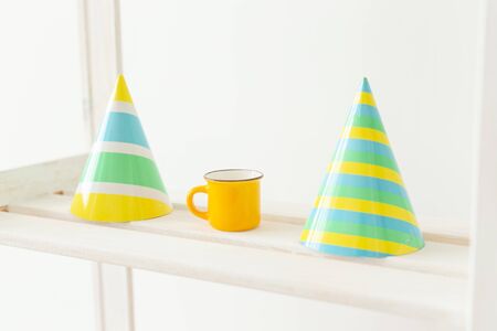 Striped colourful cones hats. Birthday holiday party conceptの写真素材