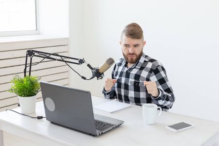 Streamer, blogger and media concept - radio dj working at studioの写真素材