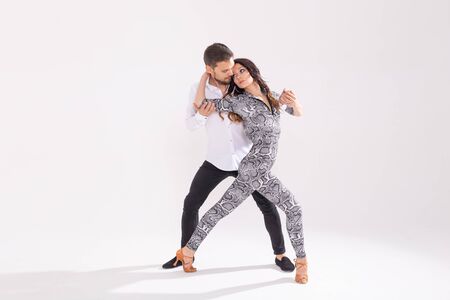 Young love couple dancing social danse kizomba or bachata over white background with copy spaceの写真素材