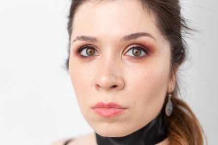 Gothic, make-up, fashion and people concept - Young stylish beautiful woman with white skin and red...