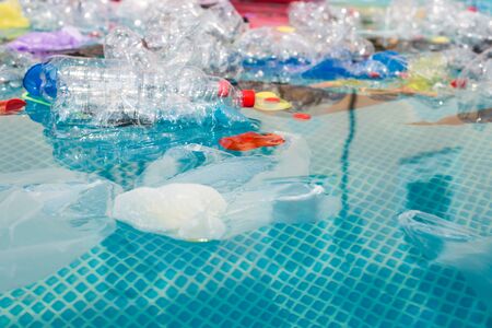Problem of trash, plastic recycling, pollution and environmental concept - Plastic rubbish pollution in water environment.の写真素材
