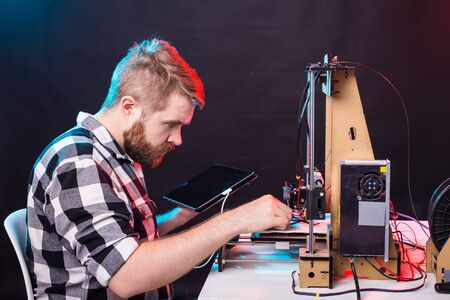 A student man print prototype on 3D printer