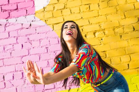 Street shaabi dance and urban dancer concept - Cheerful belly dancer dancing with arabic music on the streetの写真素材