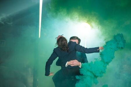 Pasadoble, latin solo dance and contemporary dance - Handsome man and woman dancing into smoke...