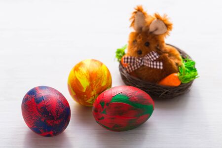 Multi-colored decorative colourful eggs on a blue background. Top viewの写真素材