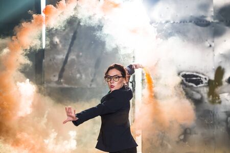 Pasadoble, latin solo dance and contemporary dance - Young beautiful female dancing into smoke cloud