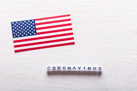 Covid-19, pandemic and virus concept - Coronavirus with american usa flag on whiteの写真素材