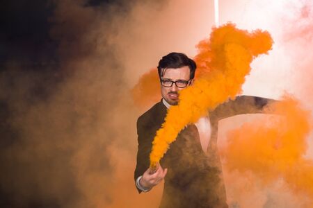 Pasadoble, latin solo dance and contemporary dance - Handsome male dancing into smoke cloud.