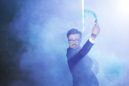 Pasadoble, latin solo dance and contemporary dance - Handsome male dancing into smoke cloud.
