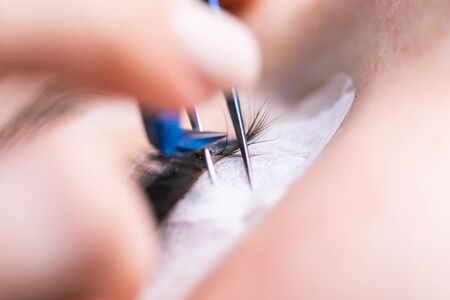 Eyelash Extension Procedure. Woman Eye with Long Eyelashes. Lashes, close up, macro, selective...
