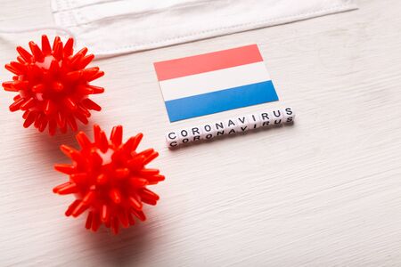 Abstract virus strain model of 2019-nCoV middle East respiratory syndrome coronavirus or coronavirus COVID-19 with text and flag Netherlands on white background. Virus pandemic protection concept.の写真素材