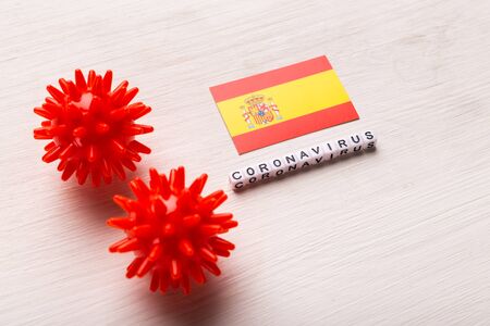 Abstract virus strain model of 2019-nCoV middle East respiratory syndrome coronavirus or coronavirus COVID-19 with text and flag Spain on white background. Virus pandemic protection concept.の写真素材