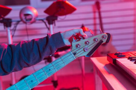 Close up of the tightening of guitar pegsの写真素材