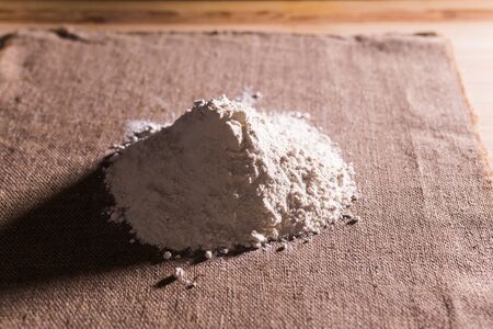 Heap of dry flour on textile. Cooking flour products conceptの写真素材