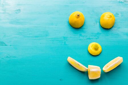 Human face smiling made from lemons with copy space. Creativity food concepts ideas. Good mood and summer concept.の写真素材