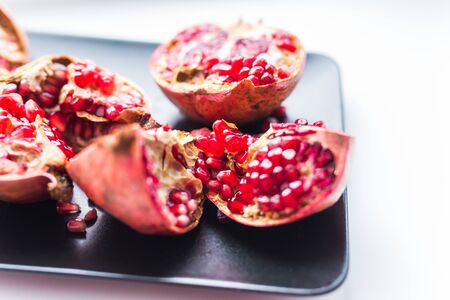 Fresh ripe pomegranate on table close up. Fruit and food.の写真素材