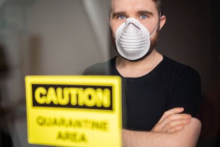 Coronavirus, quarantine, covid-19 and pandemic concept. Sad and sick man of corona virus looking...
