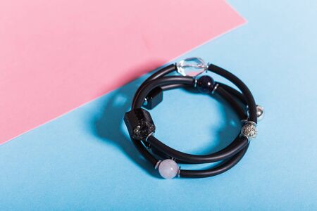 Top view of fashion jewelry and accessories on bright color background. Luxurious jewelry bijouterie...