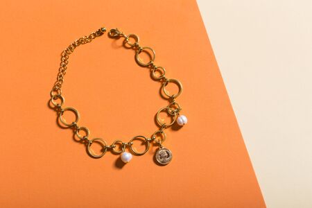 Women's Jewelry. Trendy jewelry on coloured background. Flat lay.の写真素材
