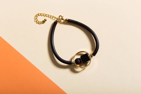 Top view of fashion jewelry and accessories on bright color background. Luxurious jewelry bijouterie...