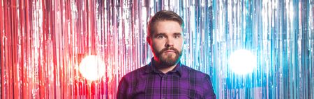 Club party and holidays concept - Portrait of handsome funny guy on shiny background.