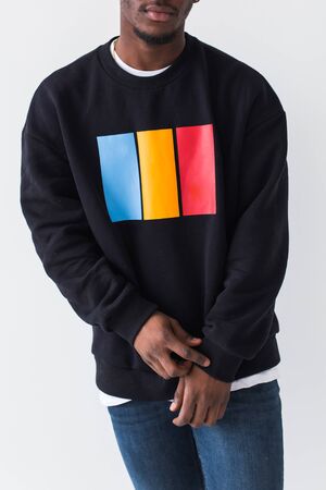 Portrait handsome young black man dressed in jeans and hoodie on white background. Street fashion...