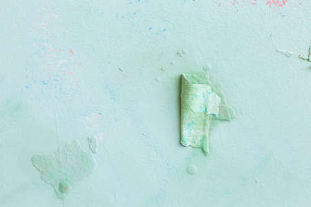 Cracked wall with old layers of paint in abandoned house.