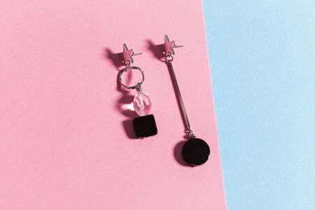 Top view of fashion jewelry and accessories on bright color background. Luxurious jewelry bijouterie...