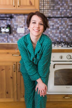 Young brunette woman relaxing at home. Quarantine, isolation, coronavirus pandemic world. Stay at home.の写真素材