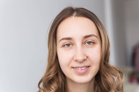 Face of a beautiful young girl with a clean fresh face close up.の写真素材