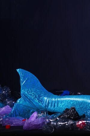 Ocean plastic pollution. Cute mermaid swimming in water with plastic garbage. Stop plastic...