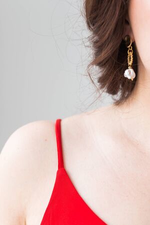 Elegant woman with silver jewelry earrings and chain, close up portrait. Accessories, jewelry and bijouterie conceptの写真素材