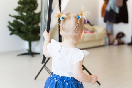 Cute baby girl playing indoors. Childhood, infant and children concept.の写真素材