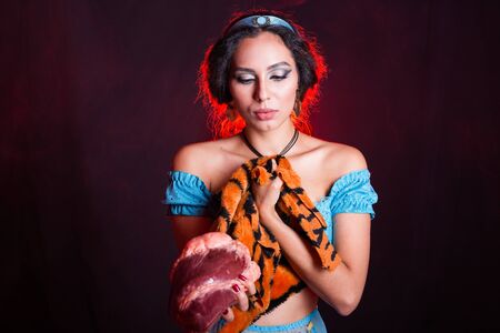 Stop animal killing concept - Pretty girl show animal skin and raw meat that she wants to tell someone dont kill animals or stopped violence against animal.の写真素材