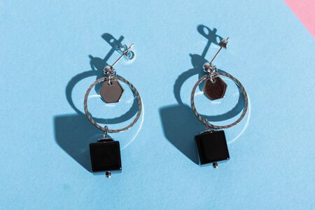 Top view of fashion jewelry and accessories on bright color background. Luxurious jewelry bijouterie...