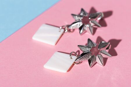 Top view of fashion jewelry and accessories on bright color background. Luxurious jewelry bijouterie and trendy.の写真素材