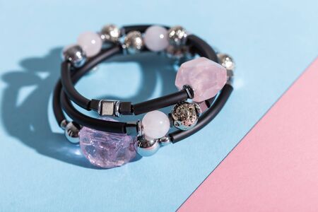 Top view of fashion jewelry and accessories on bright color background. Luxurious jewelry bijouterie and trendy concept.の写真素材