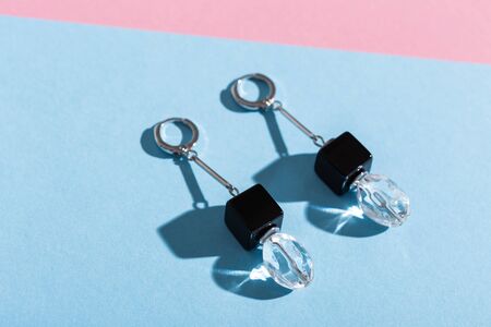 Top view of fashion jewelry and accessories on bright color background. Luxurious jewelry bijouterie and trendy.の写真素材