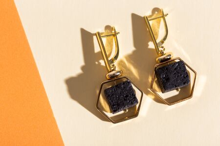 Top view of fashion jewelry and accessories on bright color background. Luxurious jewelry bijouterie and trendy concept.の写真素材