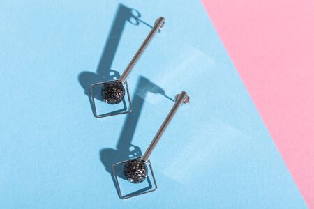 Top view of fashion jewelry and accessories on bright color background. Luxurious jewelry bijouterie and trendy concept.の写真素材