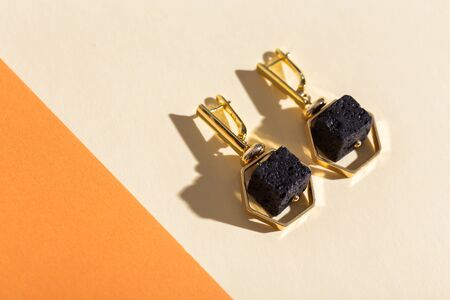 Top view of fashion jewelry and accessories on bright color background. Luxurious jewelry bijouterie and trendy.の写真素材