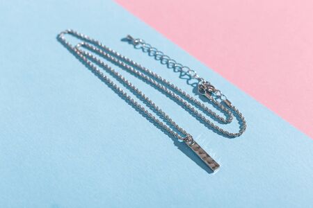 Womens Jewelry. Trendy jewelry on coloured background. Flat lay, top view.