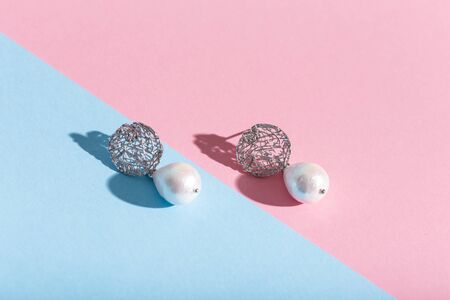 Top view of fashion jewelry and accessories on bright color background. Luxurious jewelry bijouterie and trendy.の写真素材