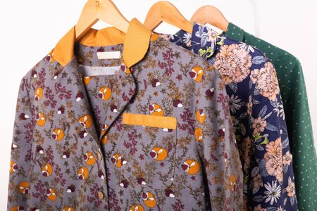 Clothing retails concept. Ladies pajamas on hangers in clothes store. Pajama in shop. Advertise,...