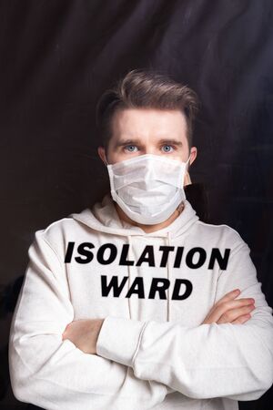 Hospital quarantine or isolation of patient standing alone in room with hopeful for treatment of Coronavirus COVID-19 Pandemic, Outbreak Efforts prevent virus spreading hazard controls concept.の写真素材