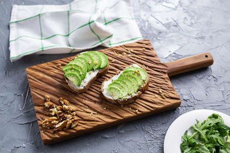 sliced avocado on toast bread with nuts