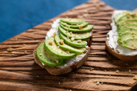 sliced avocado on toast bread with nuts
