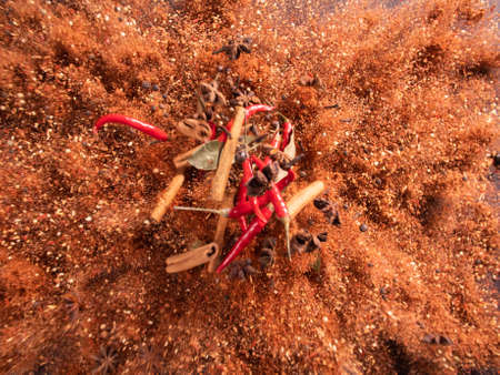Exotic spices and chilli pepper flying on. Hot spices concept.