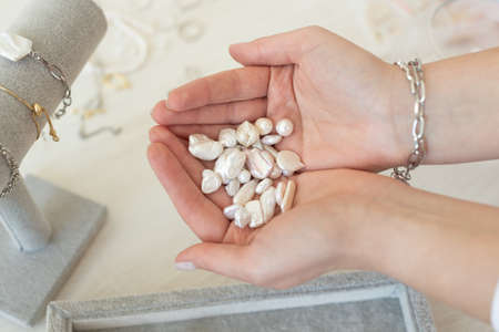 Professional jewelry designer making handmade jewelry in studio workshop. Fashion, creativity and handmade conceptの写真素材